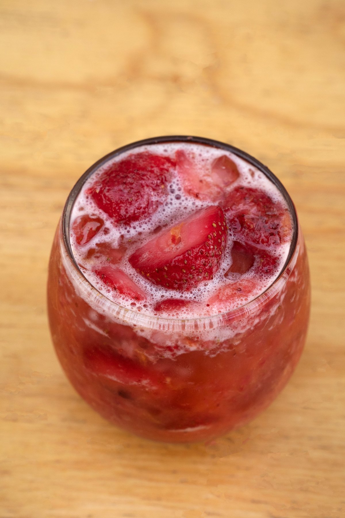 Closeup of a glass with a strawberry fruit cocktail drink