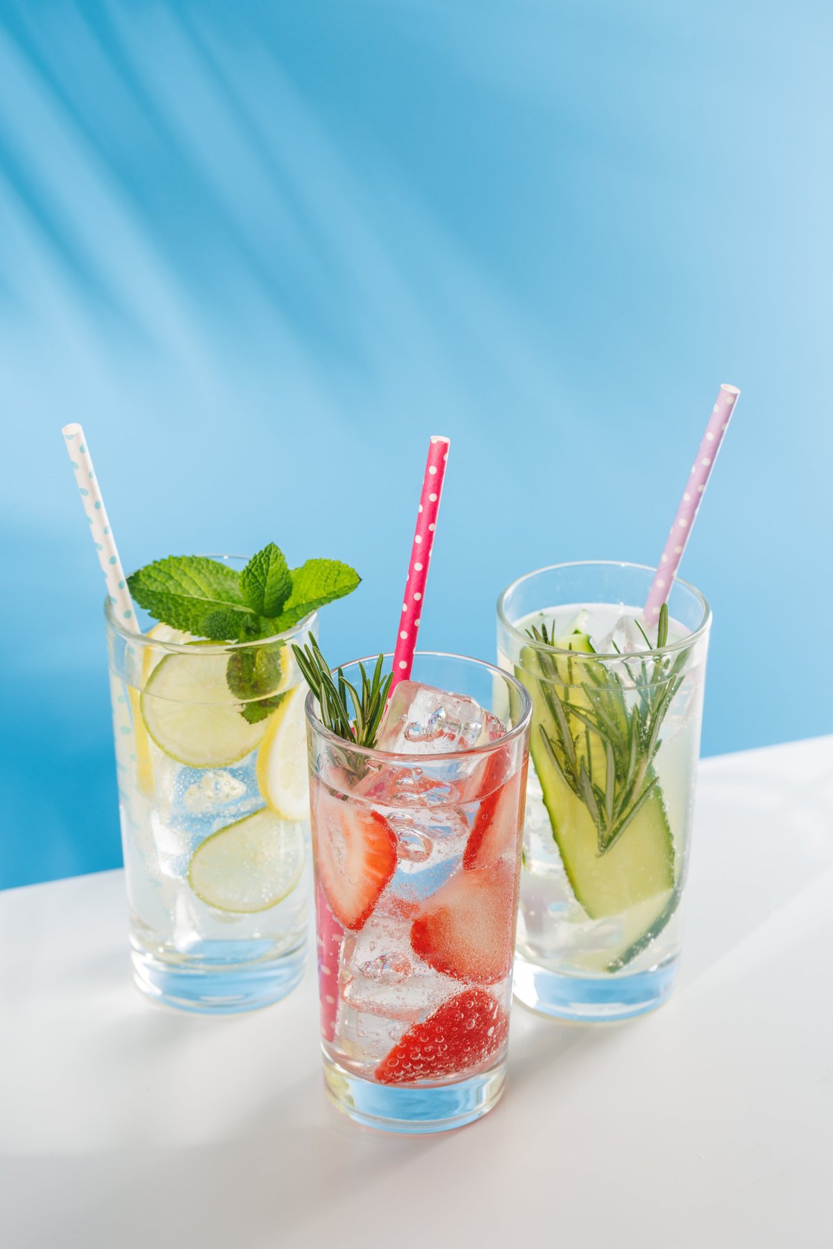 Three refreshing alcohol free drinks with strawberry, cucumber and lemon